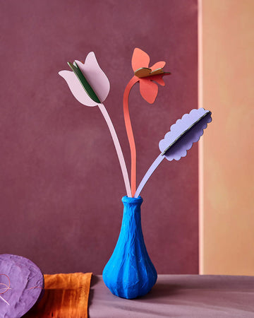editorial image of three colorful paper flowers