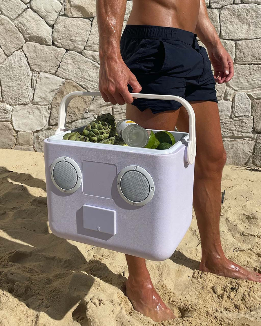 model holding lavender beach speaker cooler 
