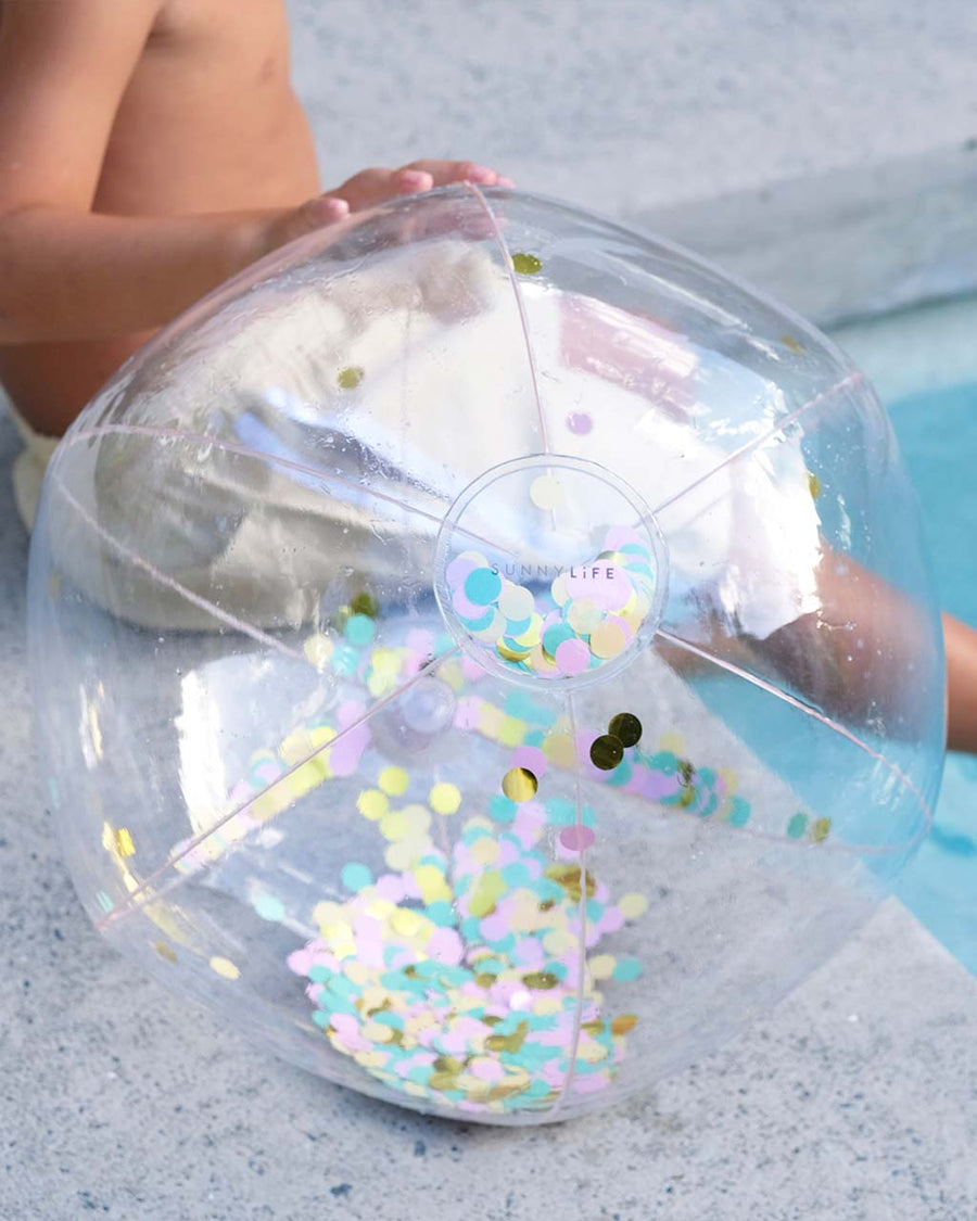 gold, mint, and lavender confetti inflatable beach ball poolside