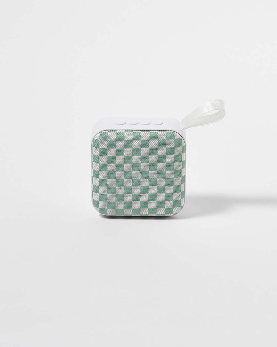 green and white checkerboard travel speaker with band