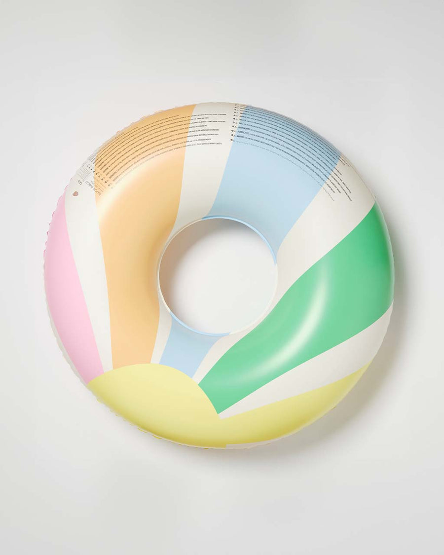 back view of cream pool ring with pastel green, blue, orange and pink sun beams