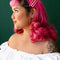 model wearing three pink acetate barrettes