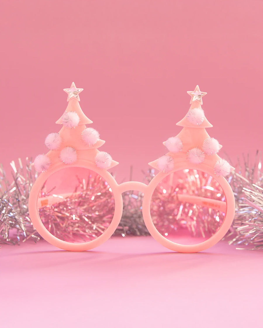 pink pastel sunglasses with pink lens and pink tree with pom details on top with silver tinsel