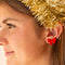 model wearing dainty red flocked bow earrings