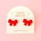 dainty red flocked bow earrings with packaging