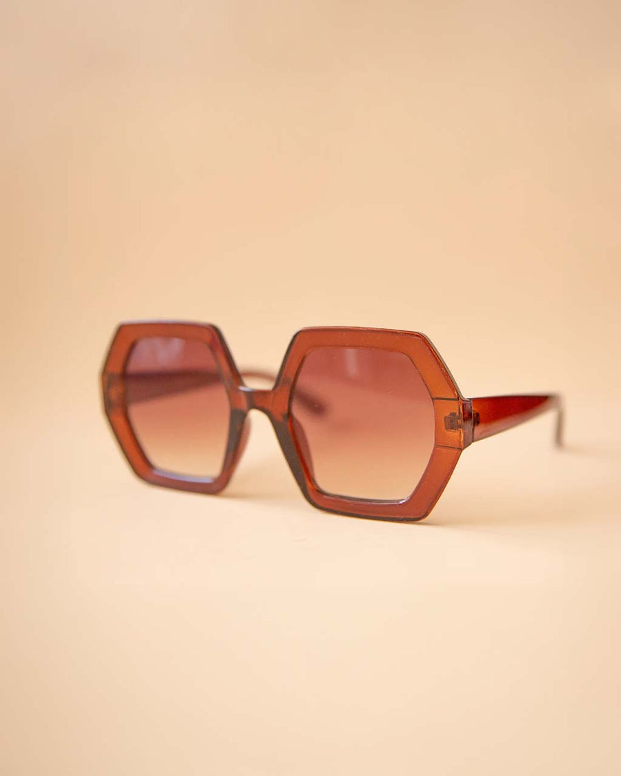 side view of brown 70's inspired hexagon shaped sunglasses