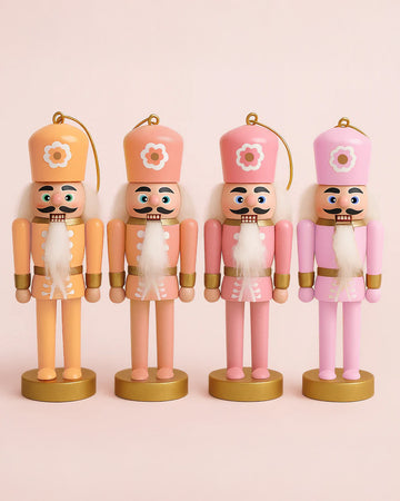 set of 4 nutcracker ornament set in mustard yellow, peach, pink and bright pink