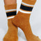 model wearing brown teddy socks with black and white stripes on the top