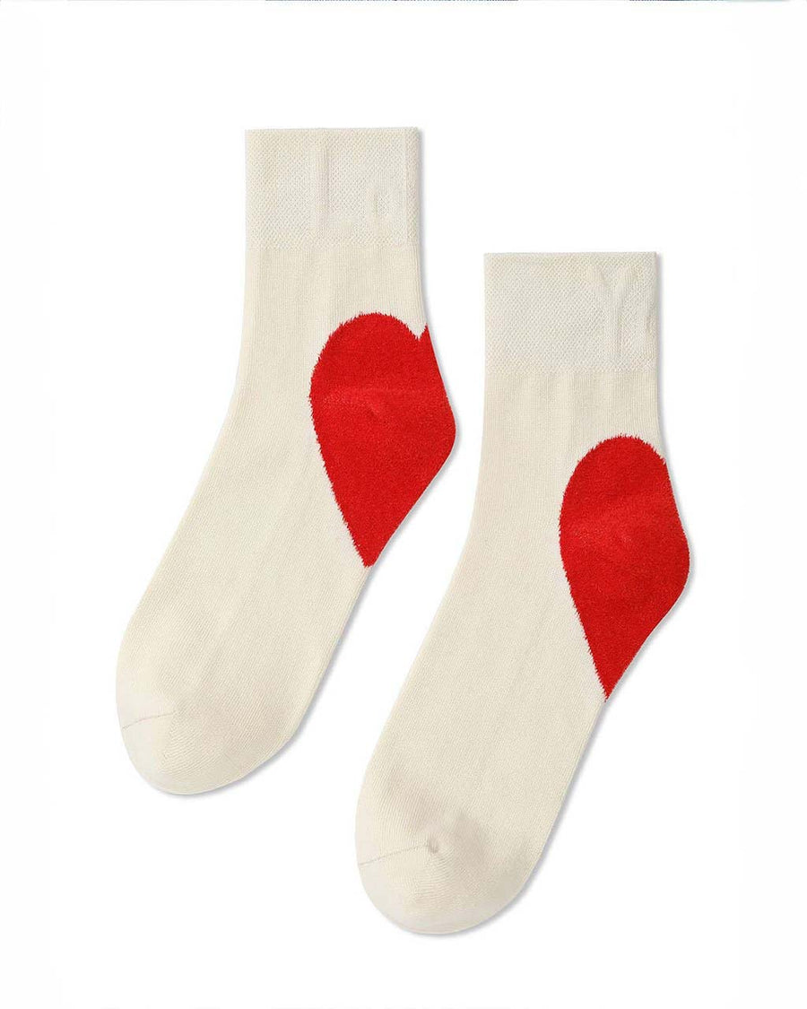 side view of white socks with red hearts on the heels