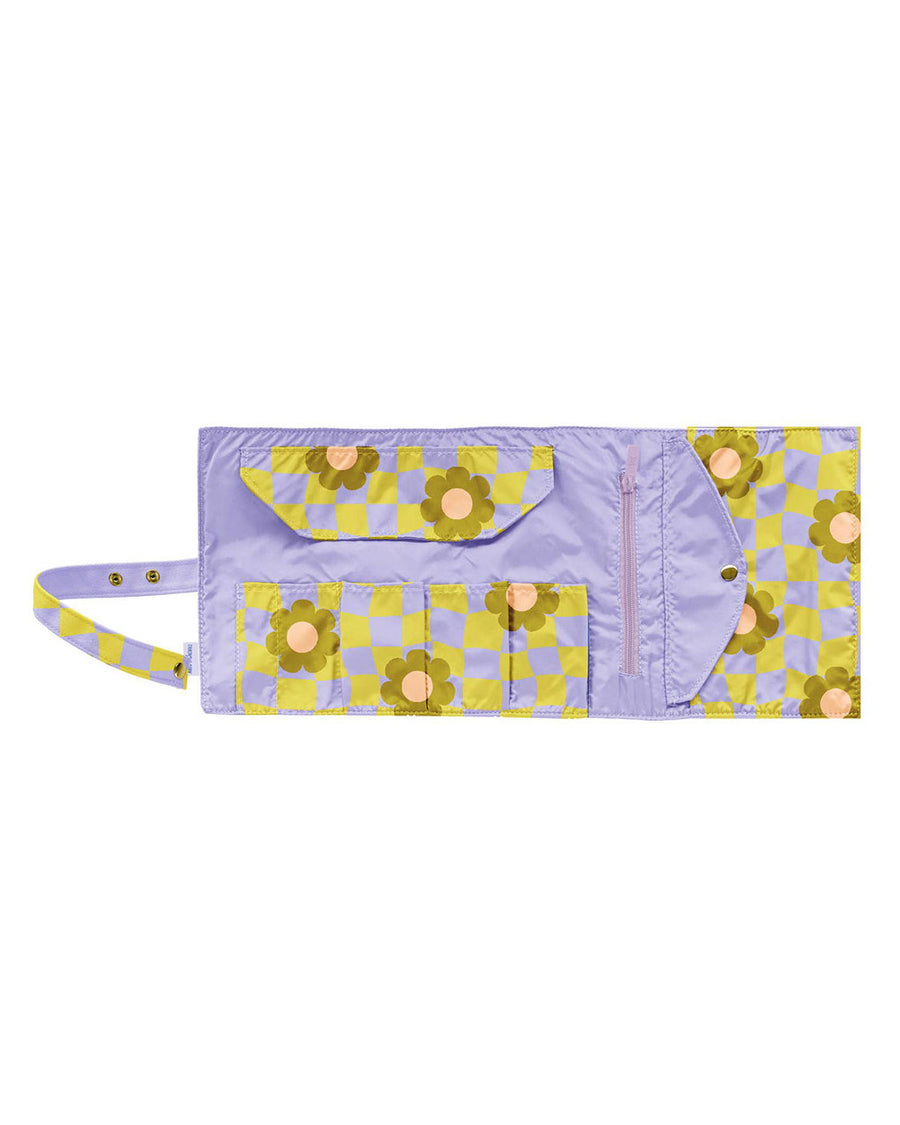 interior pockets of large tootsie roll bag with purple and yellow trippy checker and floral print
