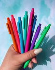 model holding set of 8 colorful gel pens