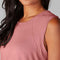 up close of model wearing dark pink active tank with hi-lo hem and muscle tank sleeves
