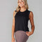 model wearing black active tank with hi-lo hem and muscle tank sleeves