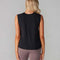 back view of model wearing black active tank with hi-lo hem and muscle tank sleeves