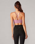 back view of model wearing wisteria sports bra