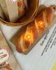 top view of lit realistic baguette shaped candle