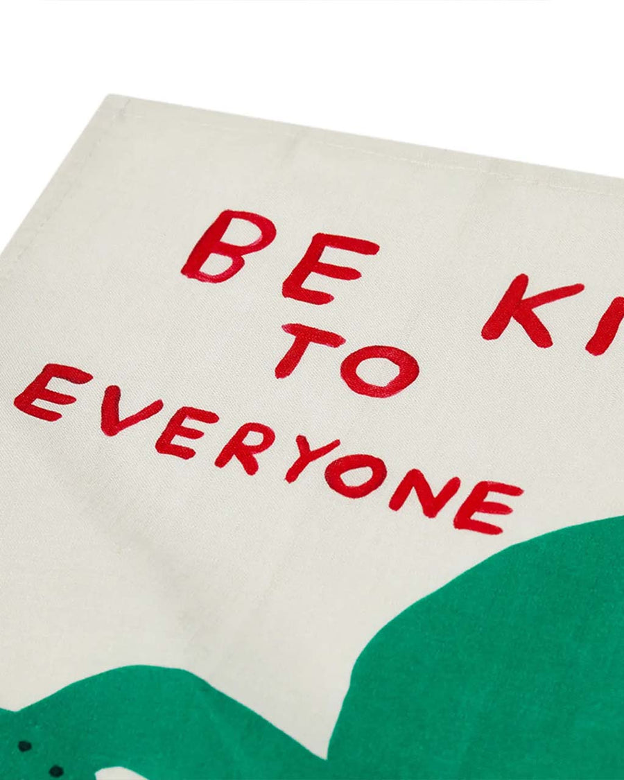 up close of cream linen tea towel with 'be kind to everyone ad to every thing' and watering can and flower graphic