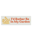 cream rectangular car magnet with red 'i'd rather be in my garden' with yellow flower design
