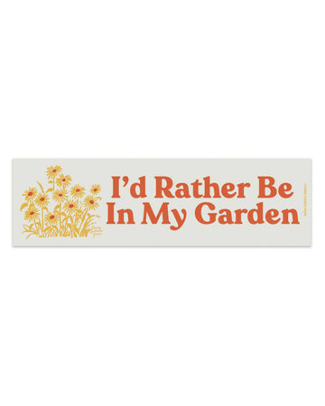 cream rectangular car magnet with red 'i'd rather be in my garden' with yellow flower design