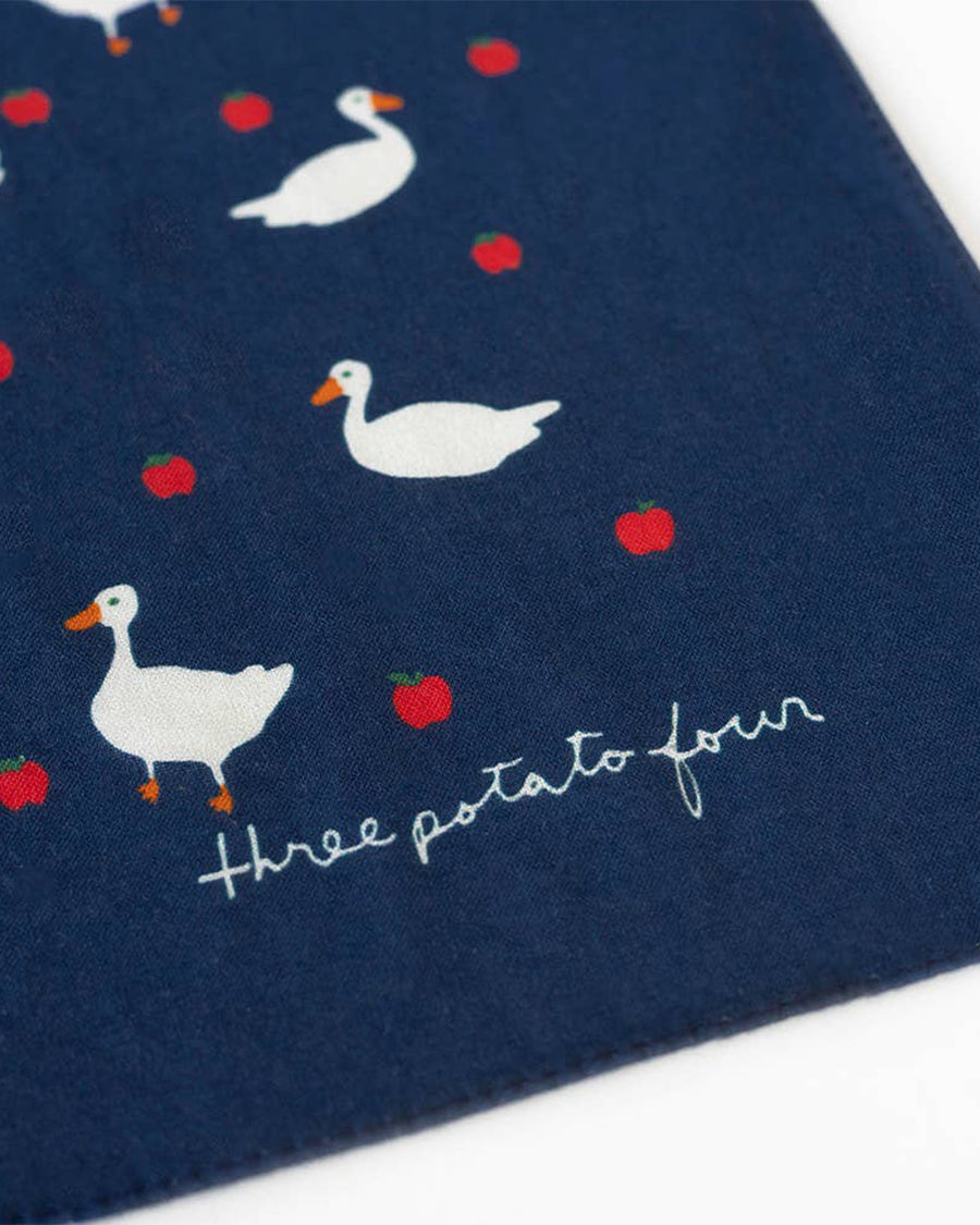 up close of navy bandana with all over goose and apple print
