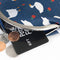 change and gift card coming out of the top of navy blue kiss and lock coin purse with goose and apple print