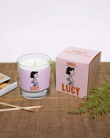 amber forest scented candle with lucy graphic