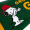 up close of green pennant flag with snoopy graphic and gold trim and 'grow a garden' typography