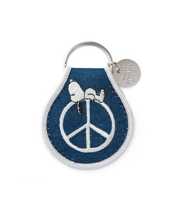 denim blue patch keychain with snoopy laying on a peace sign