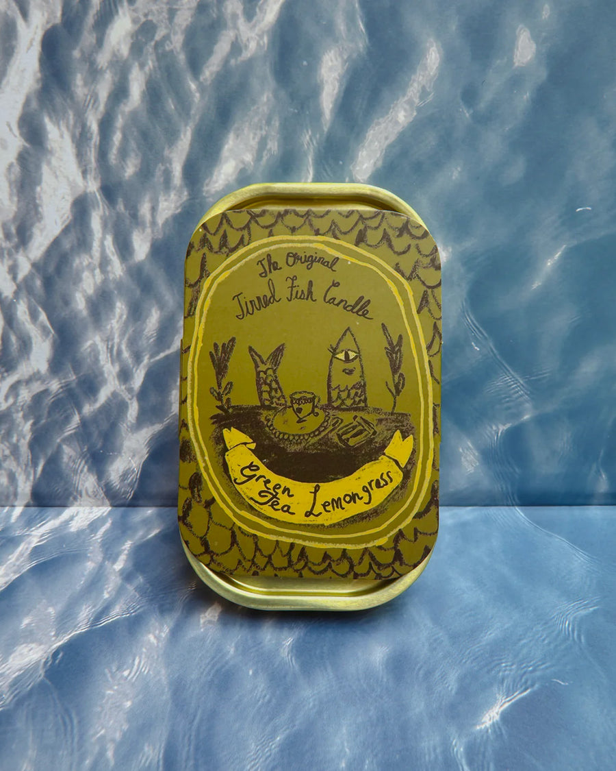 packaged green tea and lemongrass scented candle in a fish tin with fish candle inside