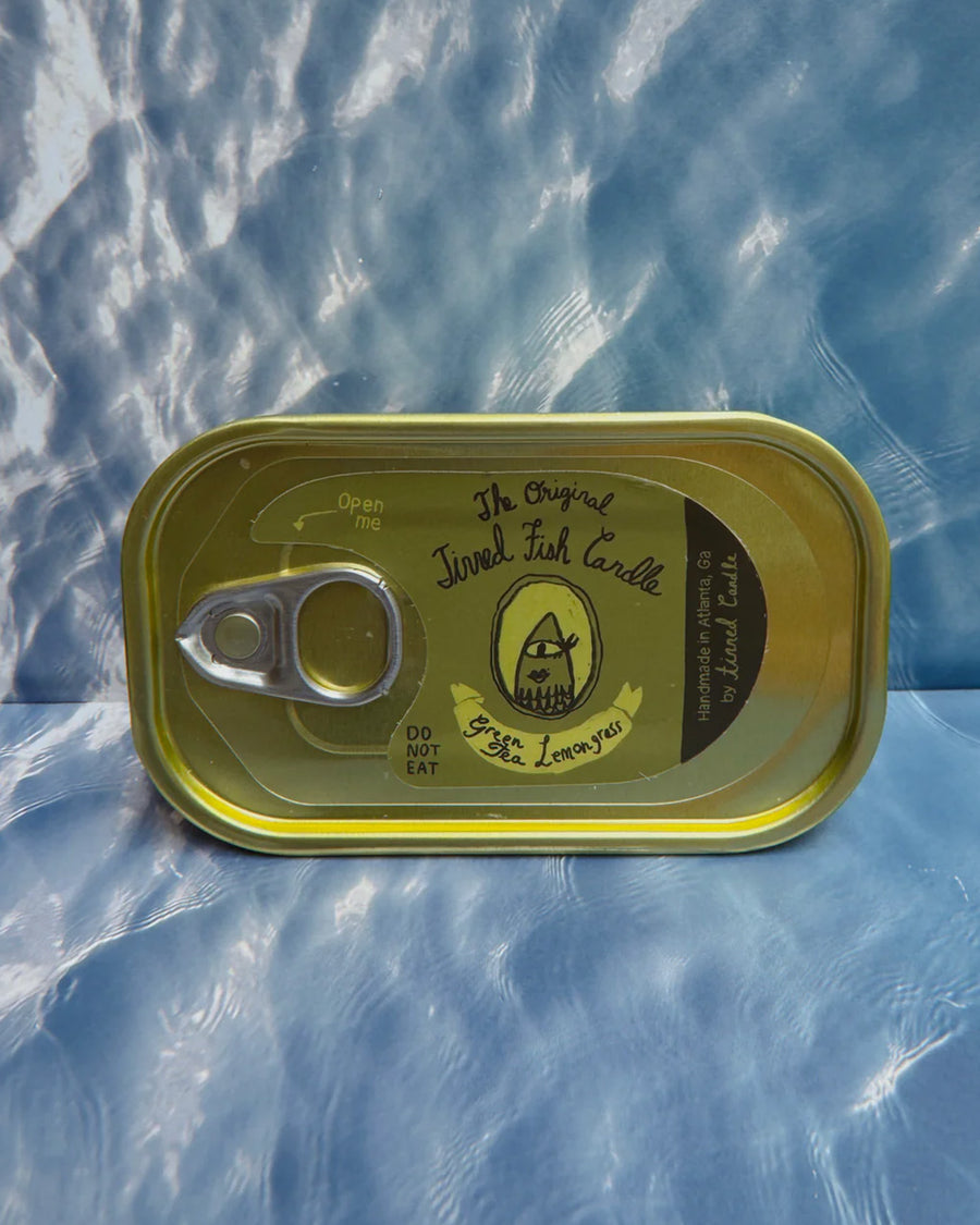 sealed green tea and lemongrass scented candle in a fish tin with fish candle inside