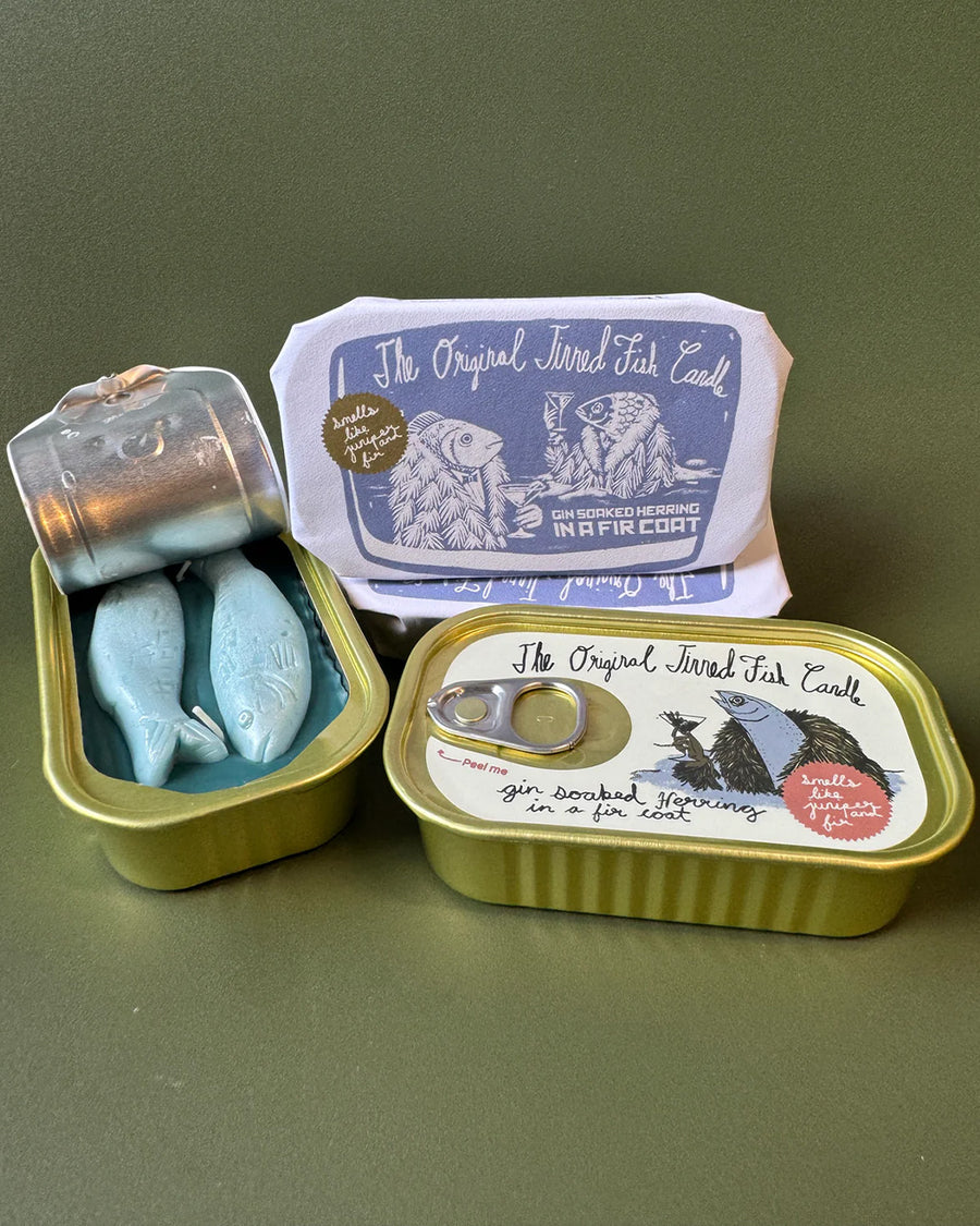 juniper and fraser fir scented candle in a fish tin with fish candle inside