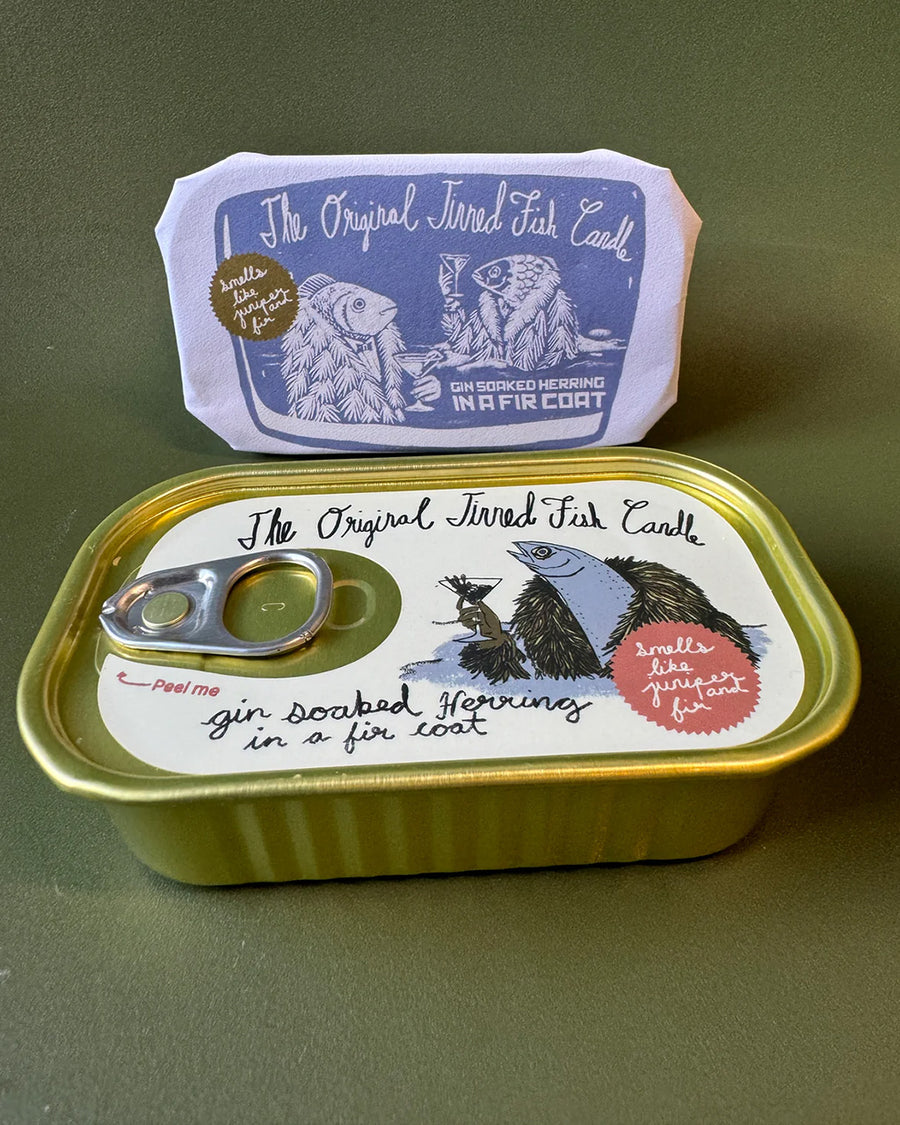 juniper and fraser fir scented candle in a fish tin with fish candle inside
