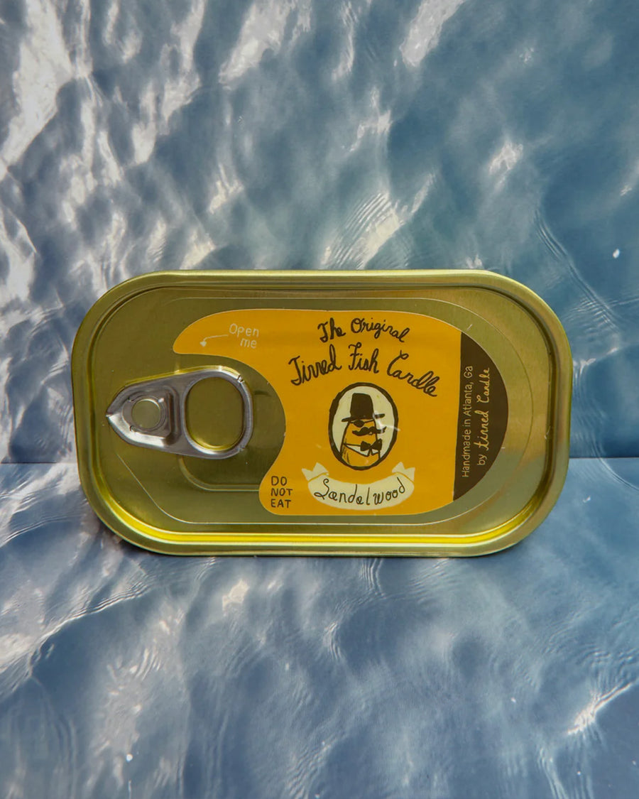sealed sandal scented candle in a fish tin with fish candle inside
