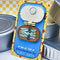 packaged red, yellow and blue interactive 'catch of the day anchovies' canned anchovies pin