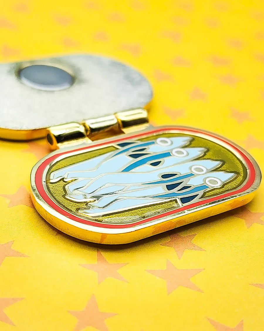 sideview of red, yellow and blue interactive 'catch of the day anchovies' canned anchovies pin