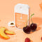 velvet peach hand sanitizer surrounded by cherries, peach slices and raspberries 