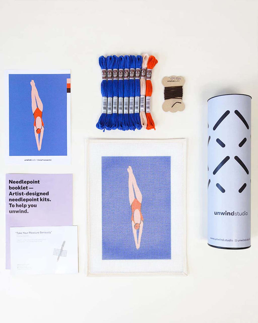 diver needlepoint kit with image, needles and embroidery string on display