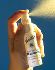 model spraying 1 fl. oz. coconut spritzer: hydrating face mist
