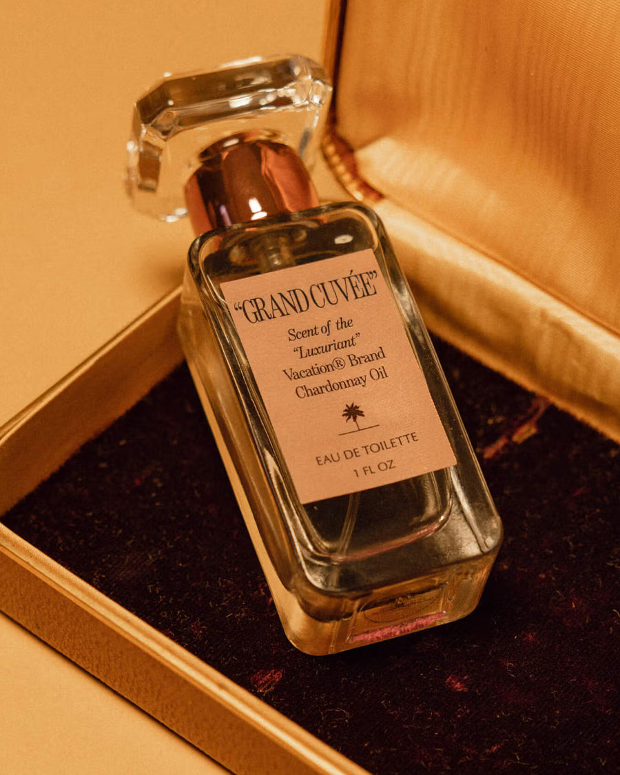 up close of grand cuvee eau de toilette bottle and box in a gold box