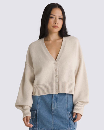 model wearing oatmeal cropped cardigan sweater with balloon sleeves