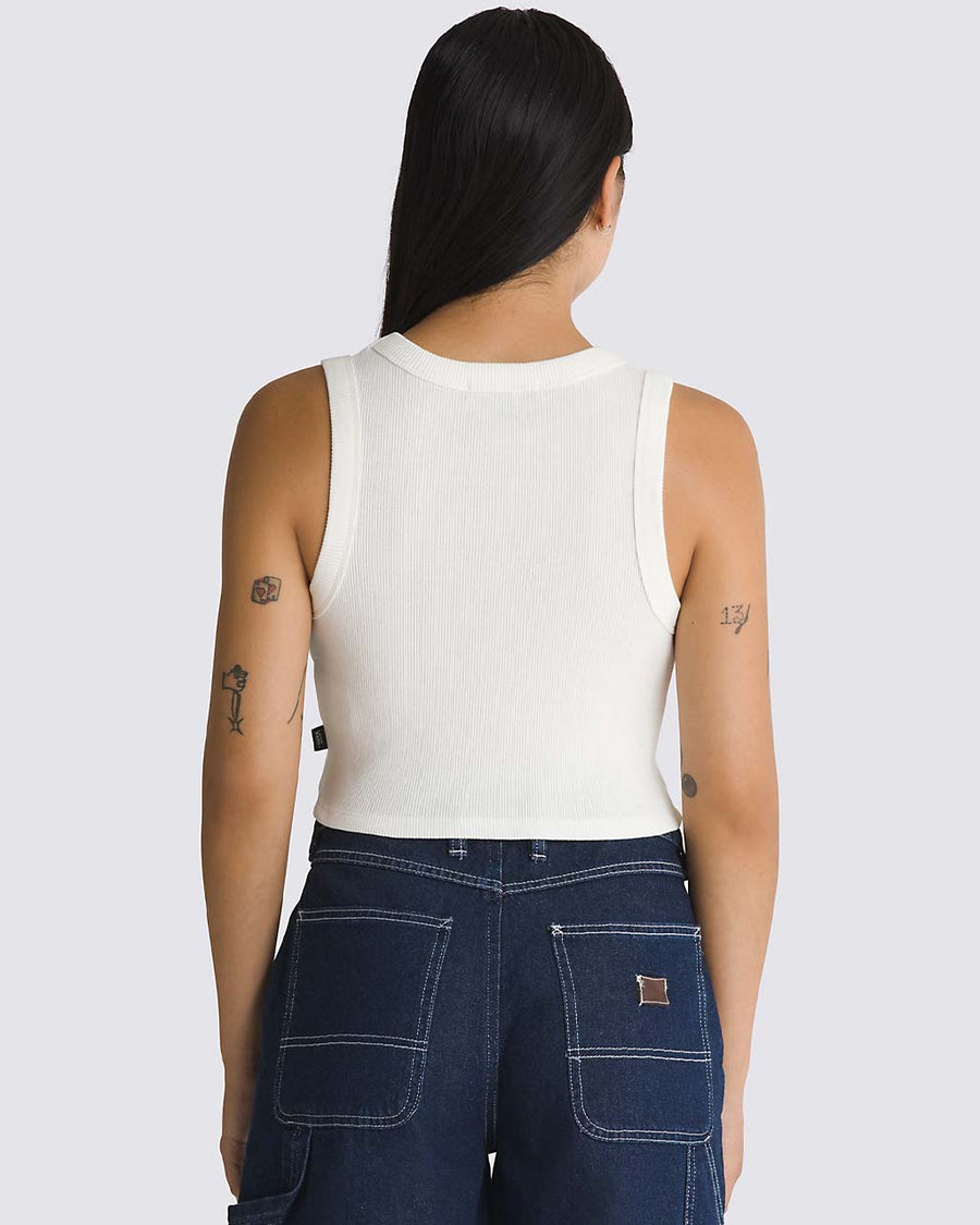 back view of model wearing cropped white tank with thick straps and ribbed material