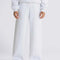 model wearing white double knit sweatpants