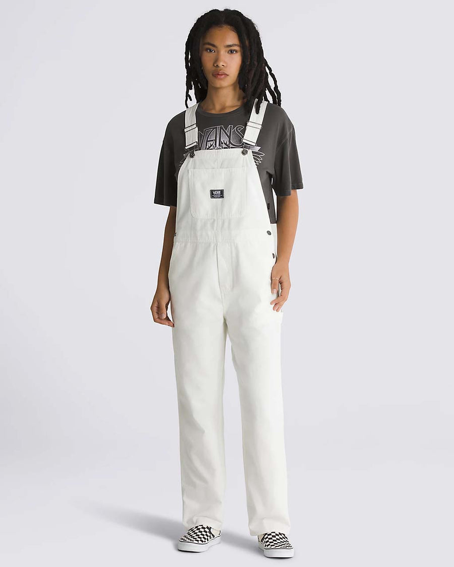 model wearing white overalls with vans patch front