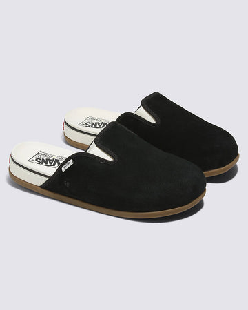 black suede mules with white sole accents
