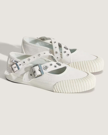 white mary jane shoes with two buckle straps with grommet details and white sole
