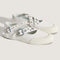 white mary jane shoes with two buckle straps with grommet details and white sole