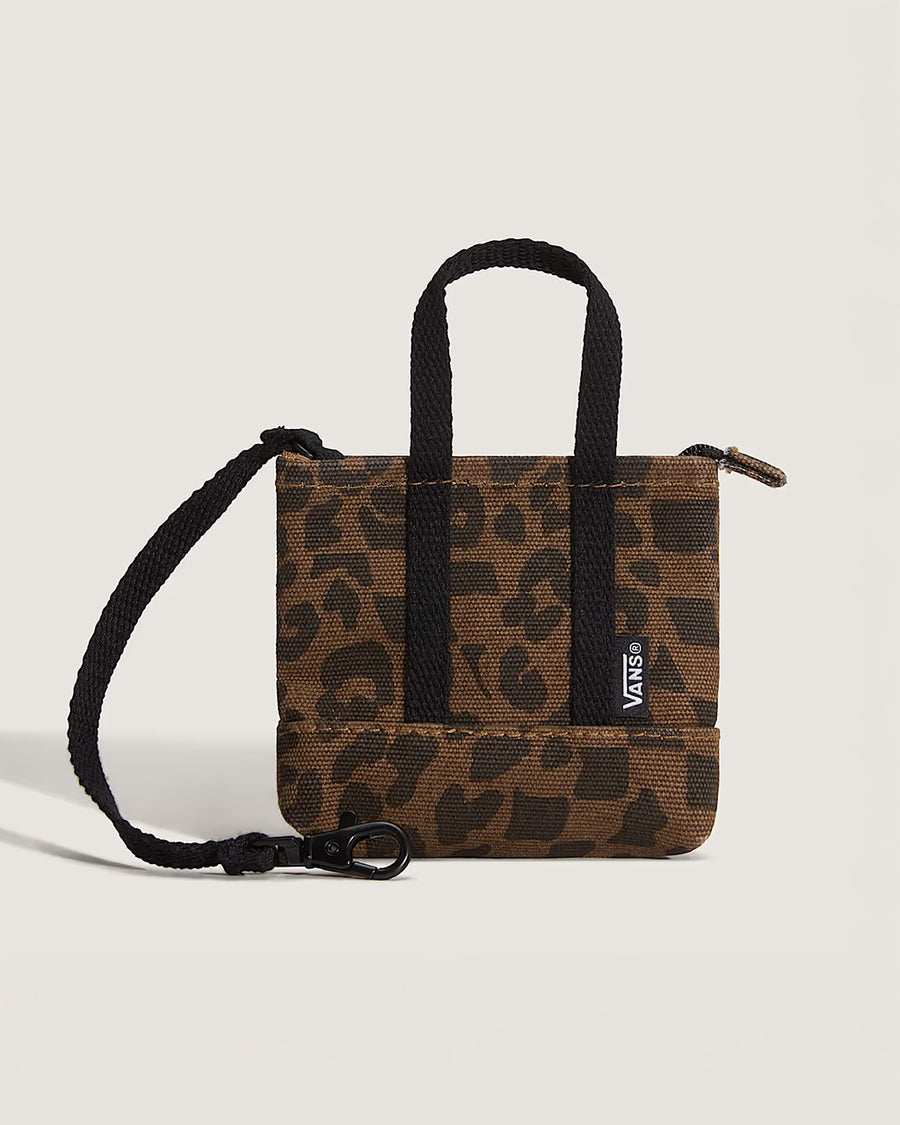 brown and black trippy checker key charm with black straps and vans logo on the front