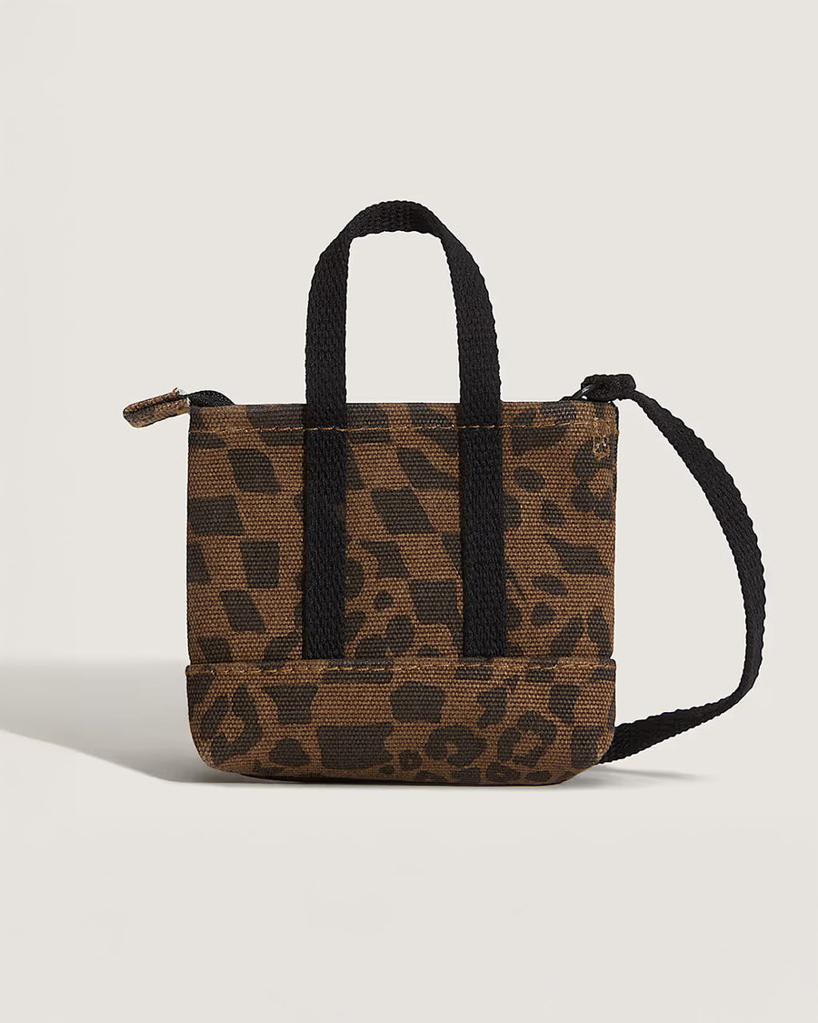 back view of brown and black trippy checker key charm with black straps and vans logo on the front