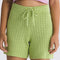model wearing green 5 in. knit shorts