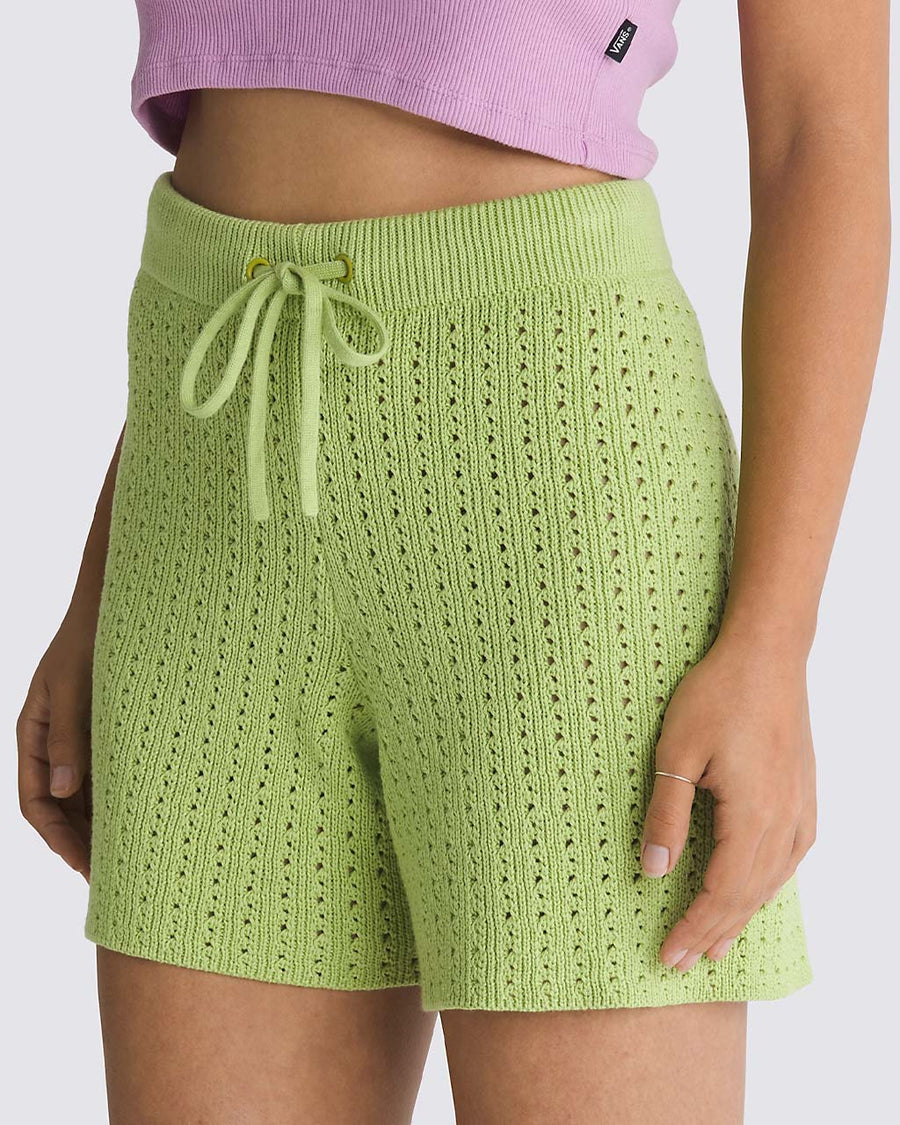 side view of model wearing green 5 in. knit shorts